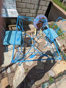 lot 60 image: Charming Vintage Wrought Iron Patio Set with Scrolled Leaf Design