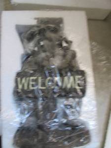 lot 9 image: new racoon welcome statue ...