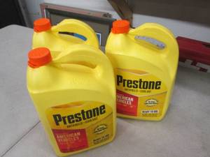lot 102 image: 31 gallon jugs of prestone antifre...