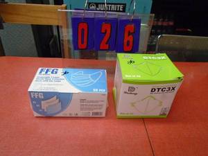 lot 26 image: Box of 20 N95 face masks & box of 50 light duty masks. As shown.