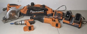lot 568 image: Ridgid Power Tool Set Circular Saw, Drill, Reciprocating Saw, 2 Batteries2 Charging Station, Storage Bag - P