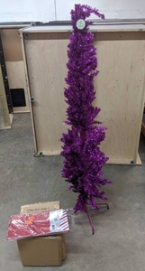 lot 284 image: New National Tree Company Christmas Decor Purple Tinsel Tree, Pre-Lit Black Hat, and Wreath & Garland Bag - N