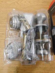 lot 139 image: Kwikset Juno Satin Nickel Exterior Entry Door Knob and Single Cylinder Deadbolt Combo Pack Featuring SmartKey Security