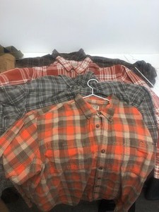 lot 148 image: Lot of Duluth Trading Company Flannel Shirts Bibs Work Pants etc