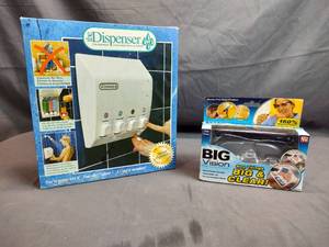 lot 12 image: Shower Soap Dispenser and Goggles
