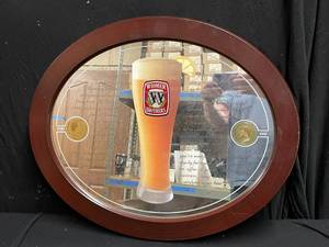 lot 33 image: Widmer Brothers oval wood framed mirror