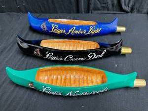 lot 154 image: Lot of 3 Leinenkugels canoe tap handles Northwoods, Creamy Dark, and Amber Light, New