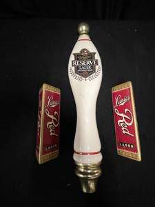 lot 160 image: Lot of 3 tap handles Leinies Red Lager and Miller Reserve Lager