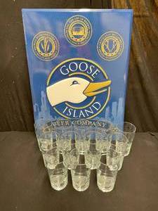 lot 103 image: Goose Island 25th Anniversary European style pint glasses with tin tacker, NEW