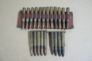 lot 71 image: 21 Reloaded .30 Cal Mixed Ammo with Leather Holder