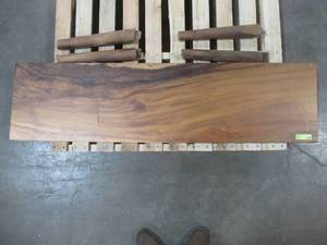 Solid Wood Walnut Rectangle Bench With 4 Wood Legs. Approximate Dimensions 60 x 15 x 1.96 - Slight Scratch and Dent, Slight mold growth from sitting in warehouse (can be sandedremoved) NO RESERVE