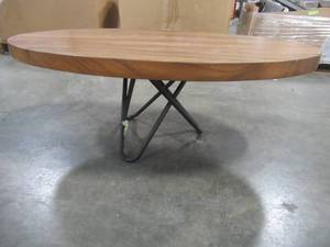 Solid Wood Elliptic Walnut Coffee Table With Metal Star Base  Approximate Dimensions 48 x 25 x 2 - Scratch and Dent, Slight mold growth from sitting in warehouse (can be sandedremoved) NO RESERVE
