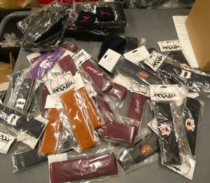 29 headbands with various teams on them and 48 wrist bands