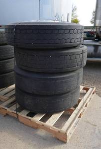 FOUR Semi tires 11R22.5  144142L  radial various brands - only about 25% but all held air, good for storage trailers, misc farm equipment