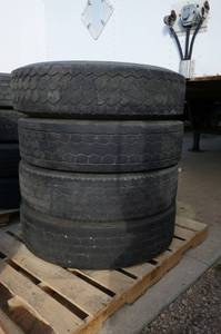 FOUR Semi tires 11R22.5  144142L  radial various brands - only about 25% but all held air, good for storage trailers, misc farm equipment