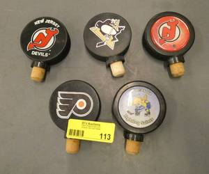FIVE hockey puck wine stoppers