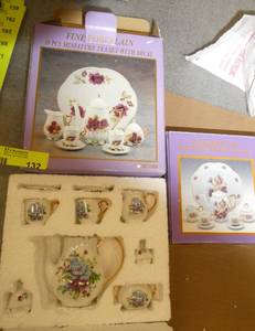 2 new mini tea sets, one is about twice the size of the other