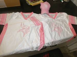 2 Girls Vikings shirts (Med and Large) and hat