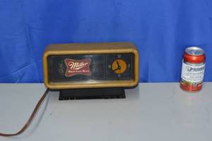 lot 3 image: Miller High life lighted clock with spinning mechanism behind