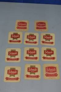 lot 18 image: 11 Schmidt double sided beer coasters