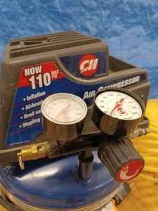 lot 16 image: Campbell Hausfeld Portable Air Compressor with Coil Air Hose and Quick Coupler