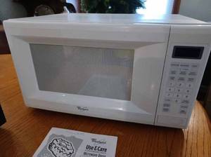 lot 52 image: Whirlpool Model MT41 Microwave Oven with Manual, Works Good