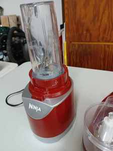 lot 60 image: Two Working Appliances Ninja Single Serve Beverage Blender and a Small Brentwood Food Processor