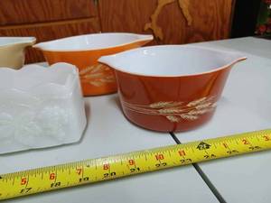 lot 69 image: 3 Pyrex Oven and Serving Bowls and an Ornate Fire King Oven and Serving Piece - White