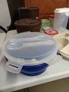 lot 81 image: 16-inch Wide by 23.5 Inch Long Plastic Storage Basket Full of Tupperware, Heft, Crofton Food Containers