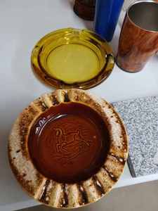 lot 102 image: Two 8-inch Glass Ash Trays, 6 Assorted Glass Vases, Marigold Glass Milk Bottle, Oak Leaf Dish and More