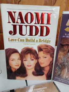 lot 109 image: Homco Ceramic Curio Lady - Missing Parasoul, Book by Naomi Judd 1993, Tapes and  Music CDs