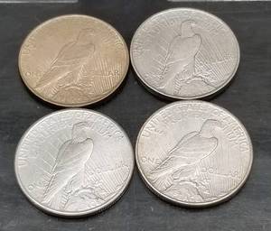 GROUP OF 4 US PEACE SILVER DOLLAR F-AU