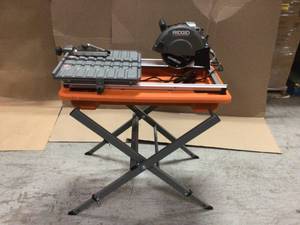 9 Amp Corded 7 in. Wet Tile Saw with Stand by RIDGID Customer Returns See Pictures