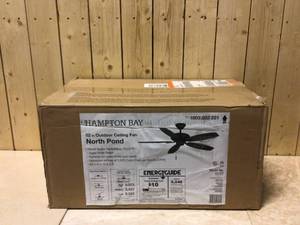 lot 78 image: Hampton Bay North Pond 52 in. IndoorOutdoor Aged Silver Ceiling Fan with Downrod and Reversible Motor Light Kit Adaptable Customer Returns See Pictures