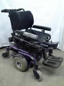 lot 21 image: Invacare TDX SPREE Powered Wheelchair With Elevation (Full vertical) & Tilt Motion. Moves in all directions. Needs a little cleaning but works great. Comes with Charger and Headrest. 
