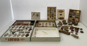 Group of rocks and arrowheads and seashells