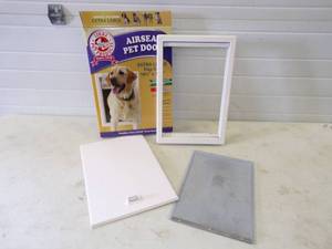 lot 57 image: Large Dog Doggy Door Frame with Hardware needs new flap