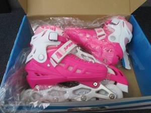 lot 175 image: Pink Medium Roller Blades...