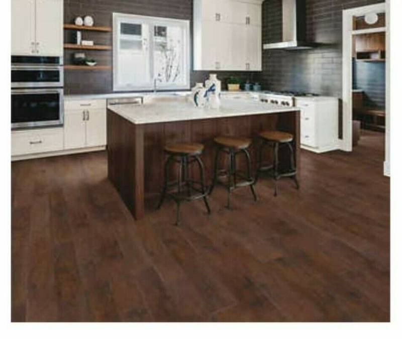 lot 704 image: Roughly 360 Sq Ft (20 Boxes) of Mohawk Rustic Spiced Oak Laminate Flooring