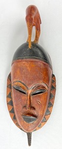 lot 32 image: Vintage African Sienna Brown Carved Mask w Arching Bird At Top- Ivory Coast