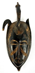 lot 35 image: African Senoufo Carved Wood Mask w Bird At Top