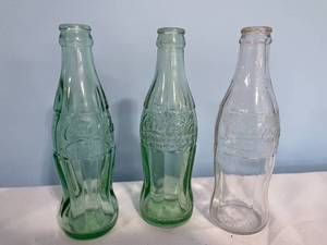 lot 73 image: Vintage Glass Coca-Cola and Seven Up Bottles