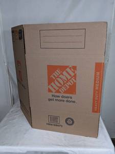 lot 141 image: Stack of 10 The Home Depot 21 x 15 x 16 Heavy Duty Medium Moving Boxes