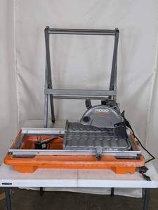 lot 24 image: RIDGID 9 Amp Corded 7 in. Wet Tile Saw with Stand