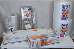 lot 216 image: Lot of Packing Supplies Plastic Sheeting, Bubble Wrap, Dish Packing and More