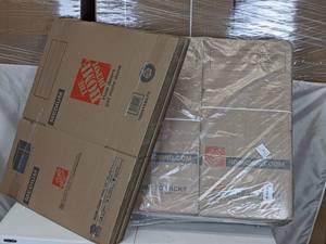lot 288 image: Stack of The Home Depot Boxes 21 in. L x 15 in. W x 16 in. D Medium Moving Box with Handles (10-Pack) and 16 in. L x 16 in. W x 16 in. D Heavy-Duty Moving Box (15-Pack)