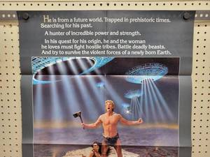 lot 1487 image: 1983 YOR, The Hunter from the Future Movie Poster - 25 x 39 - Looks like an Original that someone trimmed the white border off
