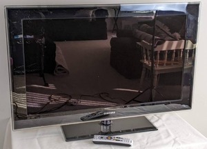 lot 2 image: Black Samsung 40 TV with Direct TV Remote