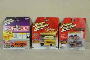 lot 141 image: Johnny Lightning Cars - Monopoly, Classic Gold, Bus, Snowmobile