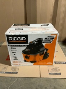 lot 6 image: RIDGID 4 Gallon 5.0-Peak HP Portable WetDry Shop Vacuum with Fine Dust Filter, Hose and Accessories. See Pictures